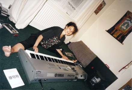 Carol doing yoga stretch by Motif.  Barnes, 2004.